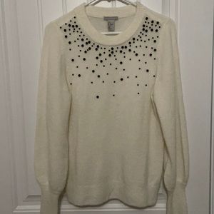 H&M lightweight off white sweater with black beaded top. Slight puff shoulders.